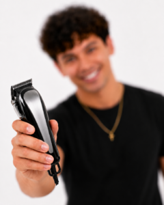 Hair Design student presenting a professional hair clipper.